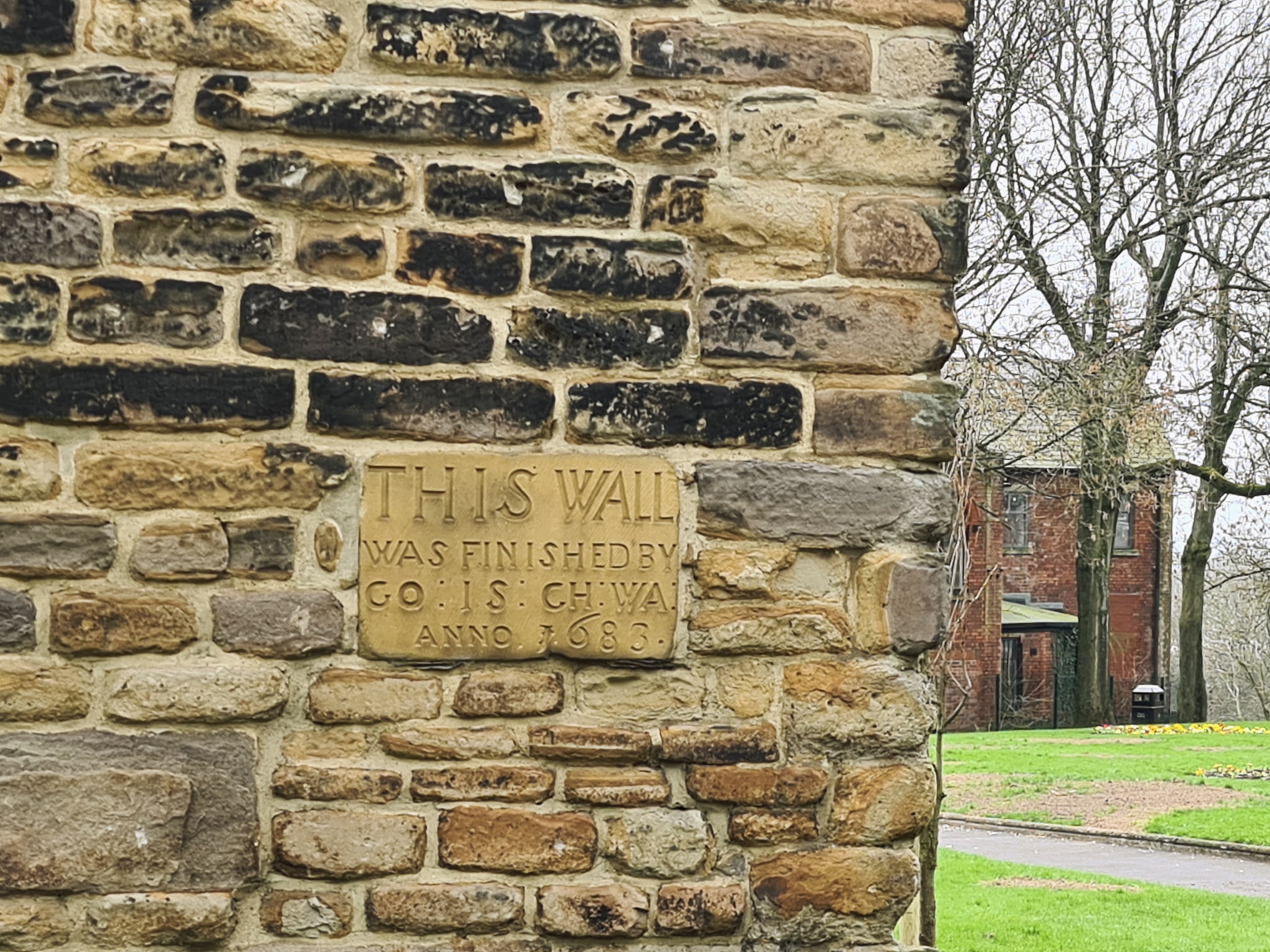 Section of wall bounding All Saints Church Yard on South